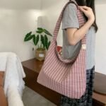 Made of canvas, lightweight, with a large capacity and a checkered pattern, this new versatile shoulder - Image 2