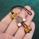 Handicrafts: woven yak bone carved keychains and mobile phone charms