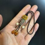 Handicrafts: woven yak bone carved keychains and mobile phone charms - Image 9