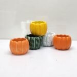 This cement succulent planter features a simple and modern design with an elegant pumpkin pattern, making it perfect for placing on an office desk or in the bedroom. - Image 9