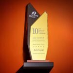 The trophy can be customized with text and is made of artificial black crystal and mirrored glass