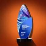 The trophy can be customized with text and is made of artificial crystal and mirrored glass