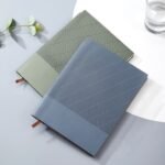 Customized corporate notebook, striped cover, PU material, with company logo and slogan printed on it